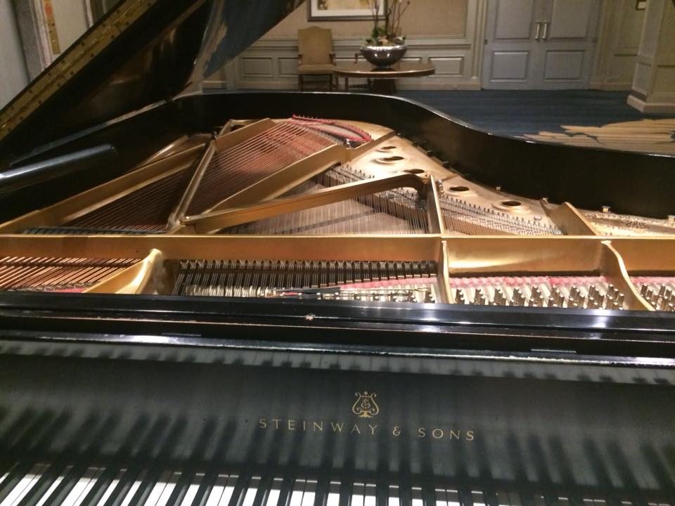 Grand piano opened for tuning
