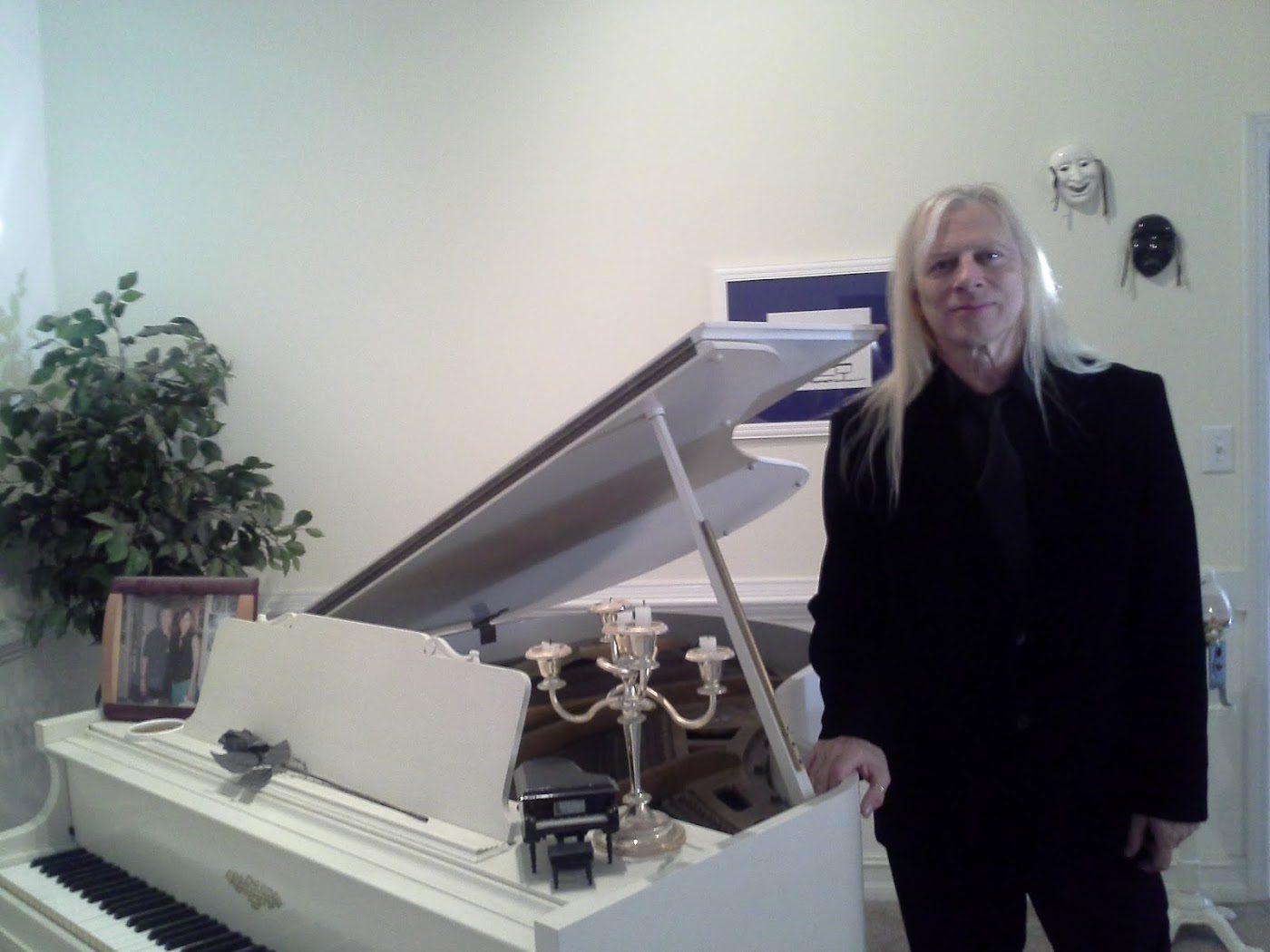 Nicky with a white grand